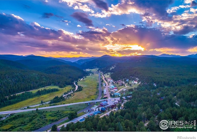 aerial view at dusk with a mountain view