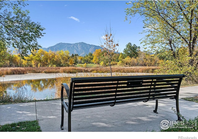 exterior space featuring a water and mountain view