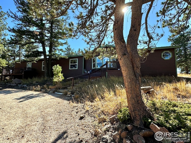 4393 Green Mountain Dr, Livermore, CO 80536 - view of front facade with a wooden deck