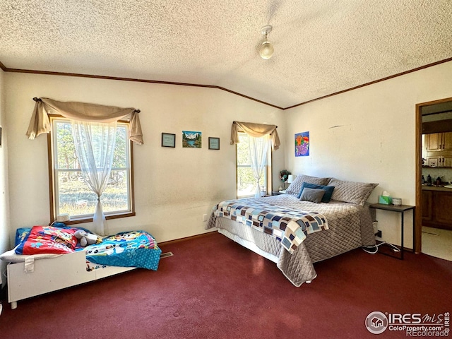 bedroom featuring a textured ceiling, carpet floors, and vaulted ceiling