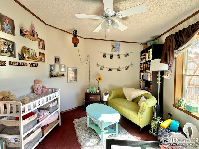 interior space featuring a textured ceiling, ceiling fan, and crown molding