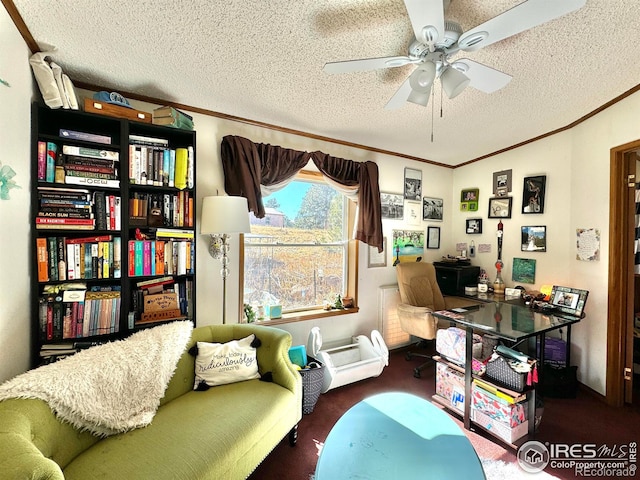 home office featuring ceiling fan and a textured ceiling