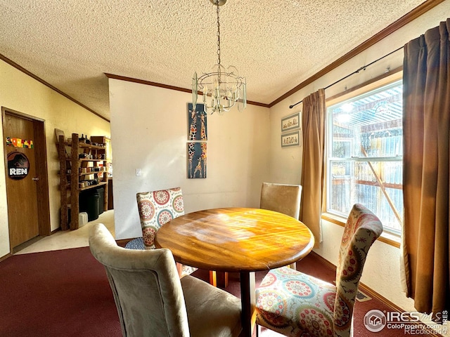 4393 Green Mountain Dr, Livermore, CO 80536 - dining room with crown molding, a chandelier, a textured ceiling, and carpet floors