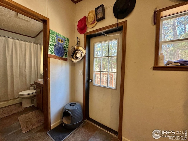 doorway to outside featuring a healthy amount of sunlight