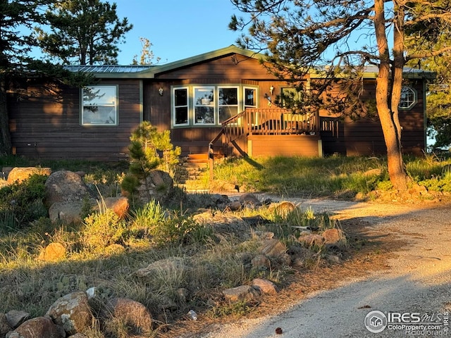 4393 Green Mountain Dr, Livermore, CO 80536 - view of front of property featuring metal roof and a deck