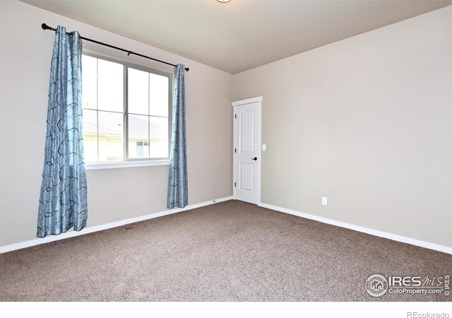 view of carpeted spare room