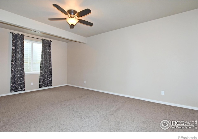 unfurnished room with carpet and ceiling fan