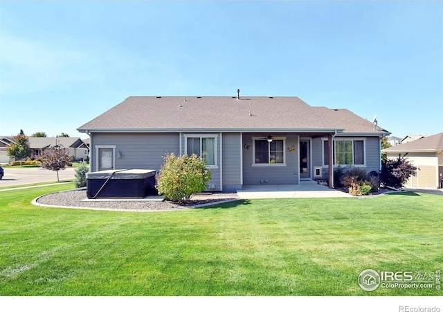 rear view of property featuring central air condition unit, a yard, and a patio