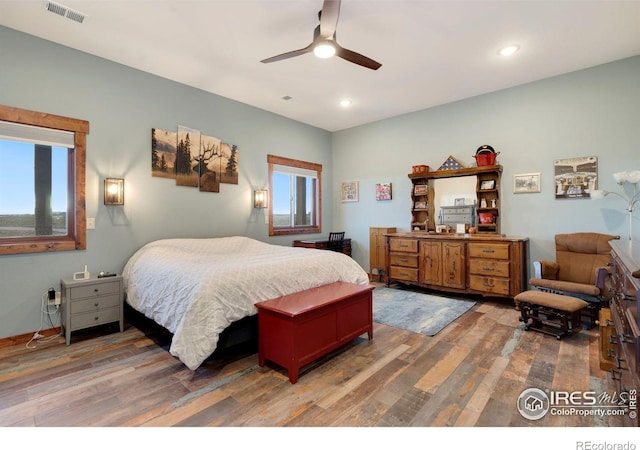 bedroom with hardwood / wood-style flooring and ceiling fan