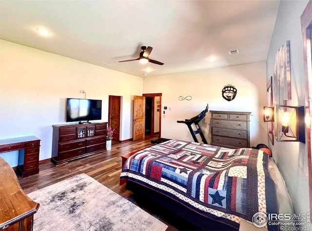 bedroom with dark wood-type flooring and ceiling fan