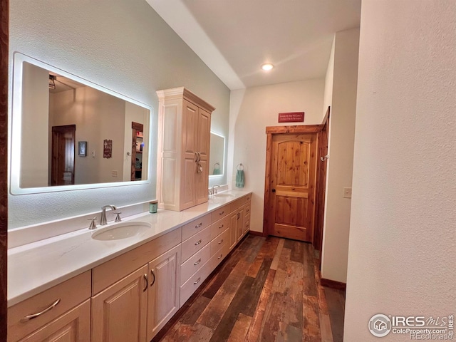 bathroom with vanity and hardwood / wood-style flooring