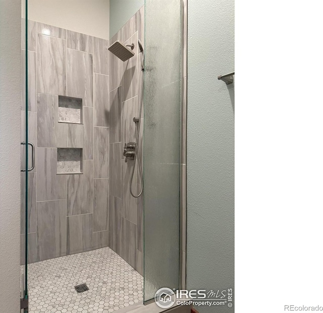 bathroom featuring an enclosed shower