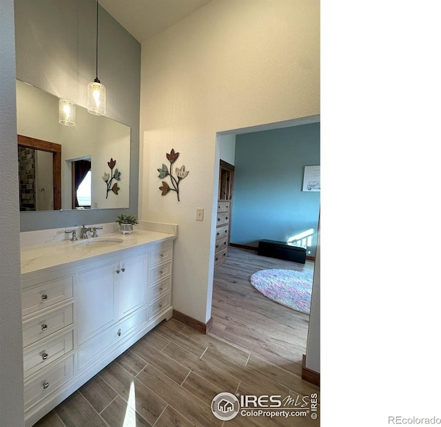 bathroom with vanity and wood-type flooring