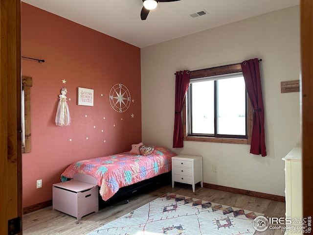 bedroom featuring ceiling fan and hardwood / wood-style floors