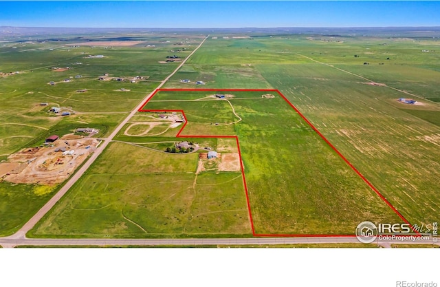 birds eye view of property featuring a rural view