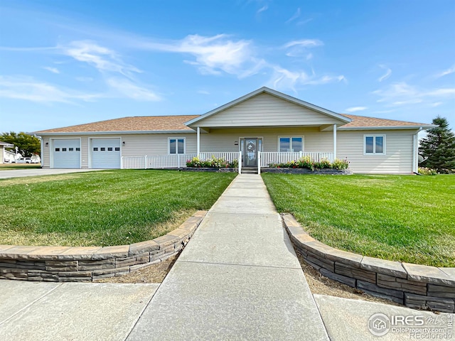 single story home featuring a front yard, a porch, and a garage