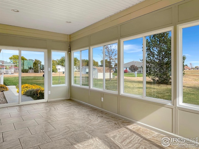 unfurnished sunroom with a healthy amount of sunlight