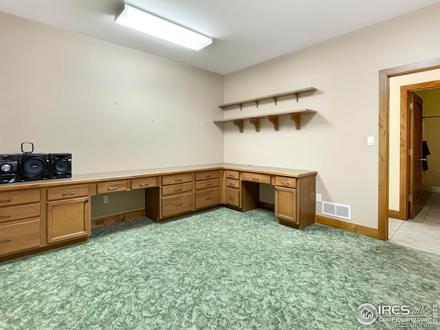1241 S Sherman Ave, Holyoke, CO 80734 - unfurnished office featuring built in study area, light carpet, baseboards, and visible vents