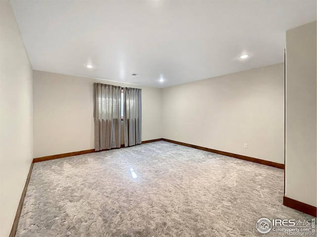 1241 S Sherman Ave, Holyoke, CO 80734 - carpeted spare room featuring baseboards and recessed lighting