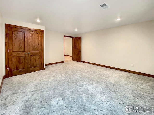 unfurnished bedroom featuring light colored carpet