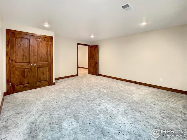 1241 S Sherman Ave, Holyoke, CO 80734 - unfurnished bedroom featuring light colored carpet, visible vents, baseboards, and recessed lighting