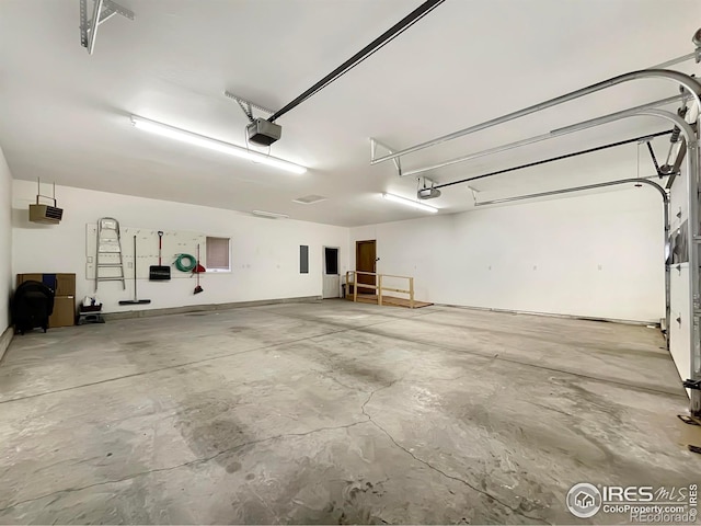 1241 S Sherman Ave, Holyoke, CO 80734 - garage featuring a garage door opener