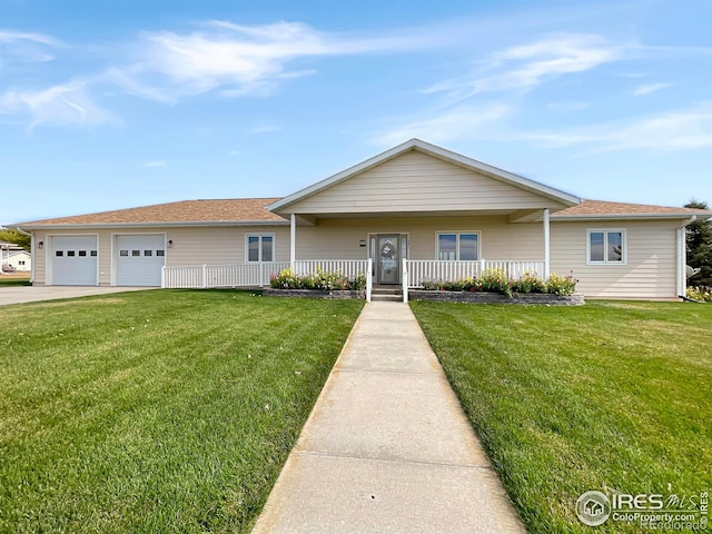 1241 S Sherman Ave, Holyoke, CO 80734 - single story home featuring a porch, a garage, a front lawn, and driveway