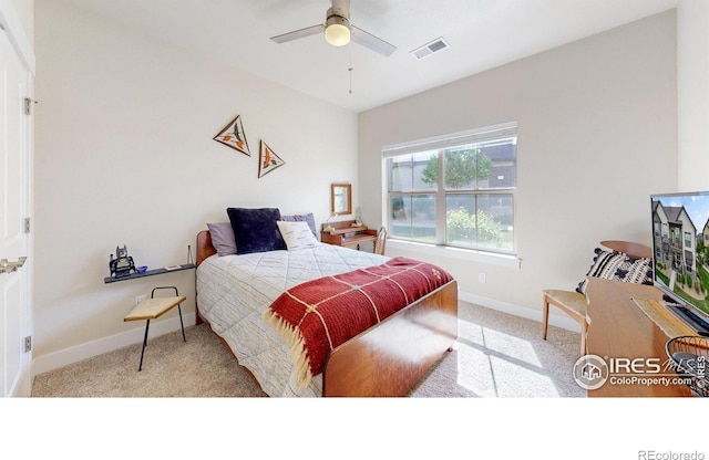 bedroom featuring ceiling fan and light carpet