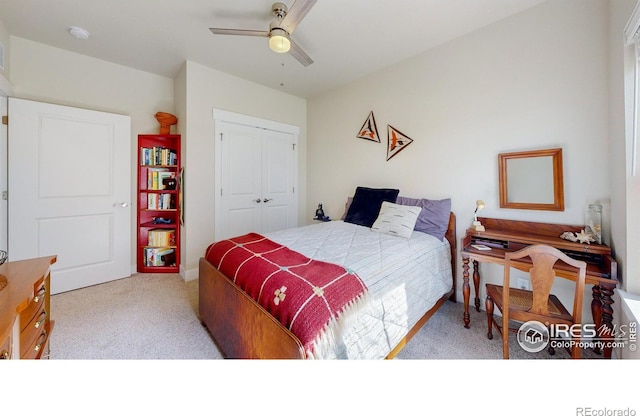 bedroom featuring a closet, ceiling fan, and light colored carpet