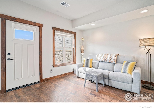 living room with dark hardwood / wood-style floors