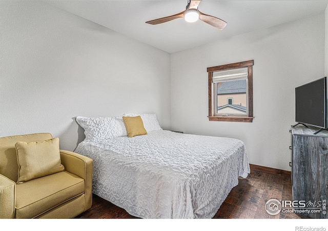 bedroom featuring dark wood-type flooring and ceiling fan