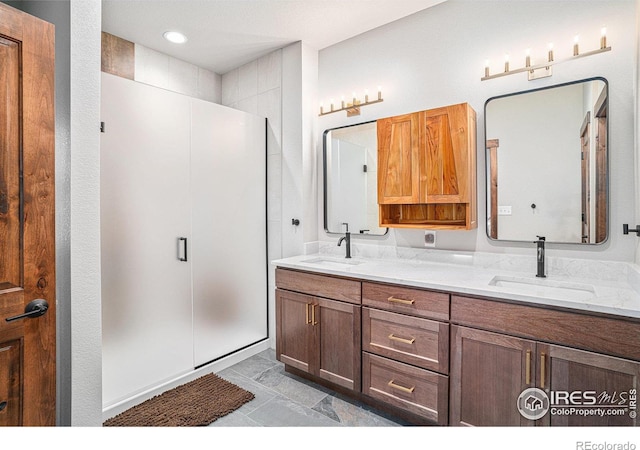 bathroom with vanity and walk in shower