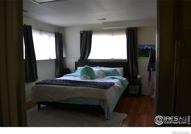 bedroom featuring dark hardwood / wood-style floors