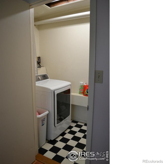 clothes washing area featuring washer / clothes dryer