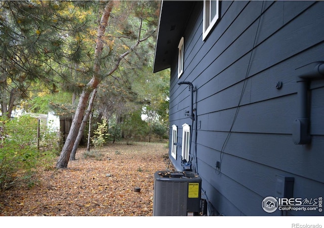 view of yard with central AC unit