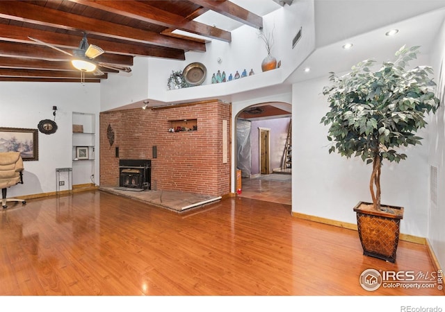 living room with beam ceiling, high vaulted ceiling, wood-type flooring, and ceiling fan