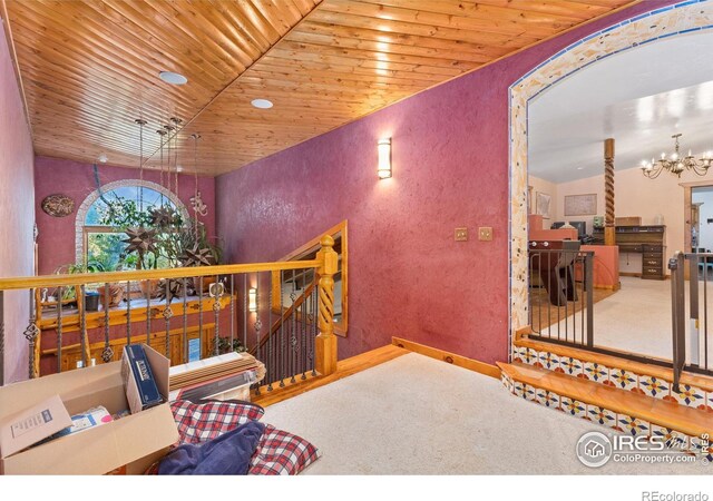 sitting room featuring an inviting chandelier, lofted ceiling, carpet flooring, and wood ceiling