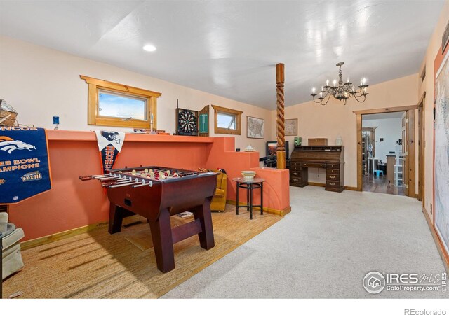 rec room featuring a notable chandelier, light colored carpet, and vaulted ceiling