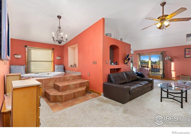 carpeted living room featuring lofted ceiling and ceiling fan with notable chandelier