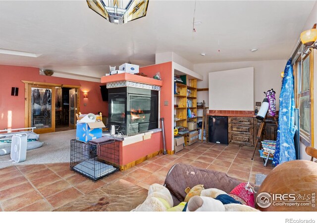 living room with carpet flooring and a multi sided fireplace