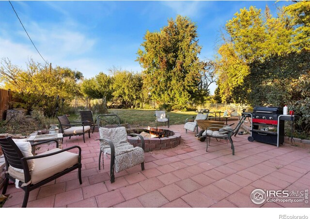 view of patio / terrace with an outdoor fire pit