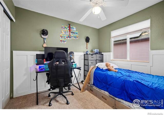 bedroom featuring carpet floors, a closet, and ceiling fan