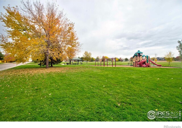 view of yard with a gazebo and a playground