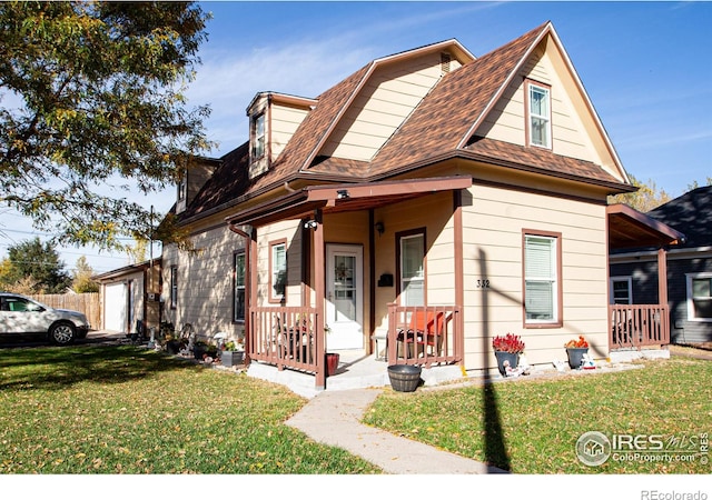 bungalow with a porch and a front yard