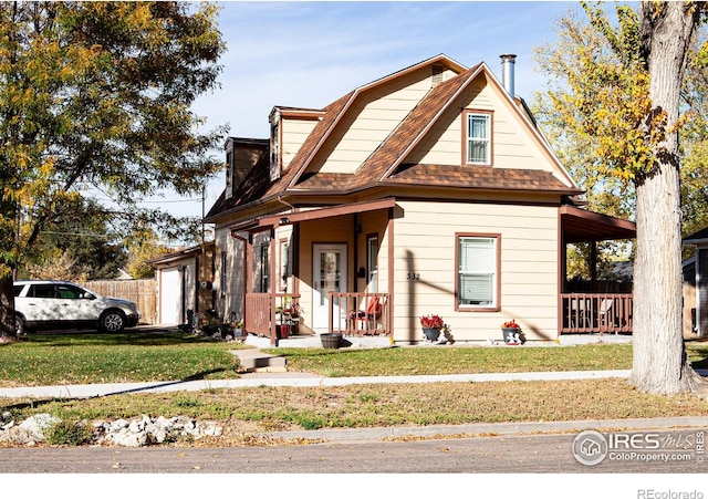 view of front of house featuring a front yard and covered porch