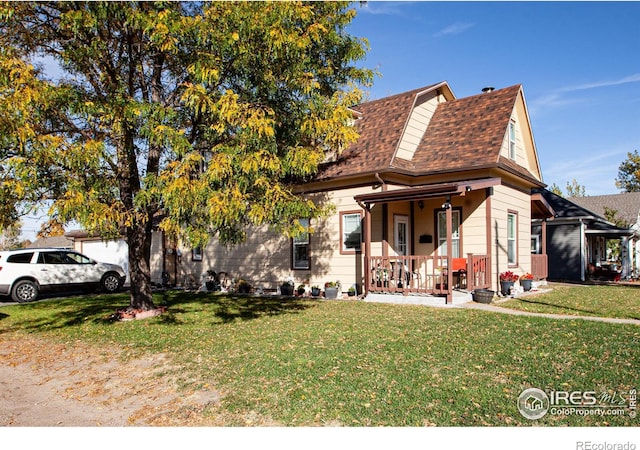 view of front of home featuring a front lawn and a porch