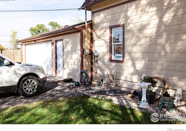 view of side of home featuring a garage