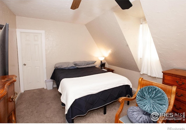 carpeted bedroom with lofted ceiling and ceiling fan