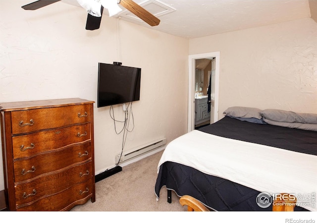 bedroom featuring light carpet, baseboard heating, ensuite bath, and ceiling fan