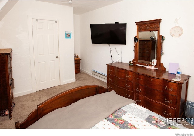 carpeted bedroom featuring a baseboard radiator